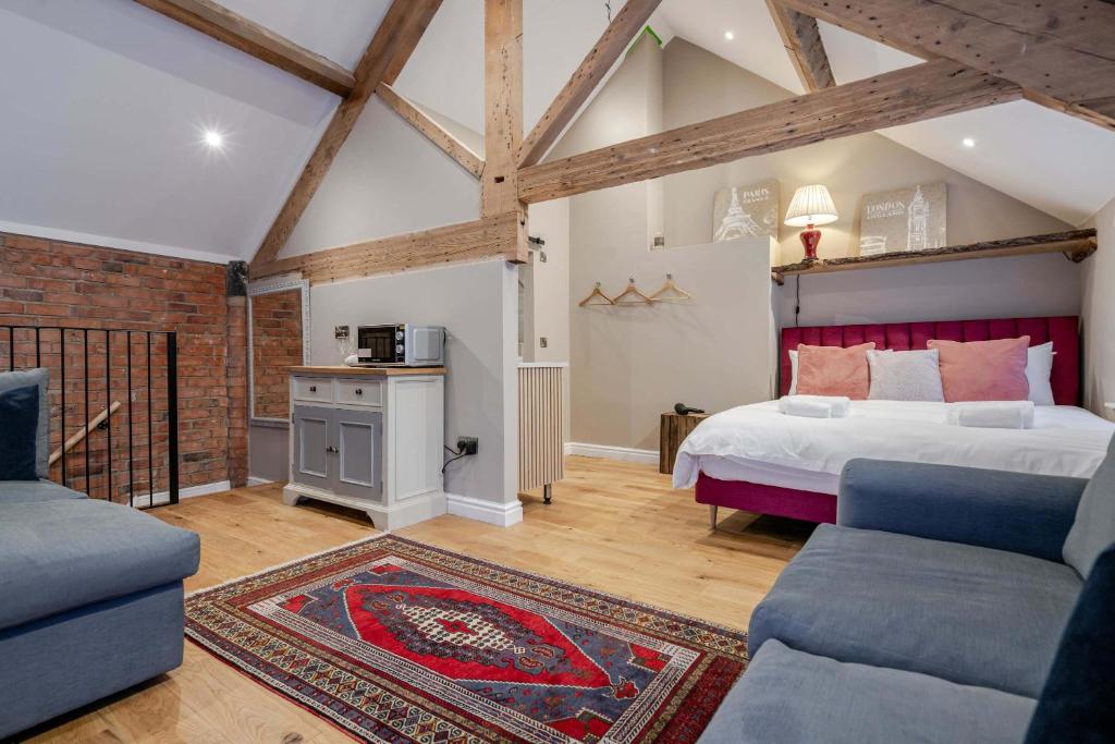 Postel nebo postele na pokoji v ubytování The Malt Loft