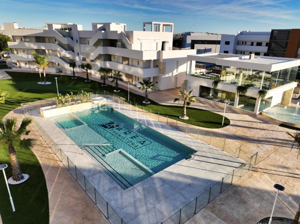 an overhead view of a building with a swimming pool at Casa Rico in Guardamar del Segura
