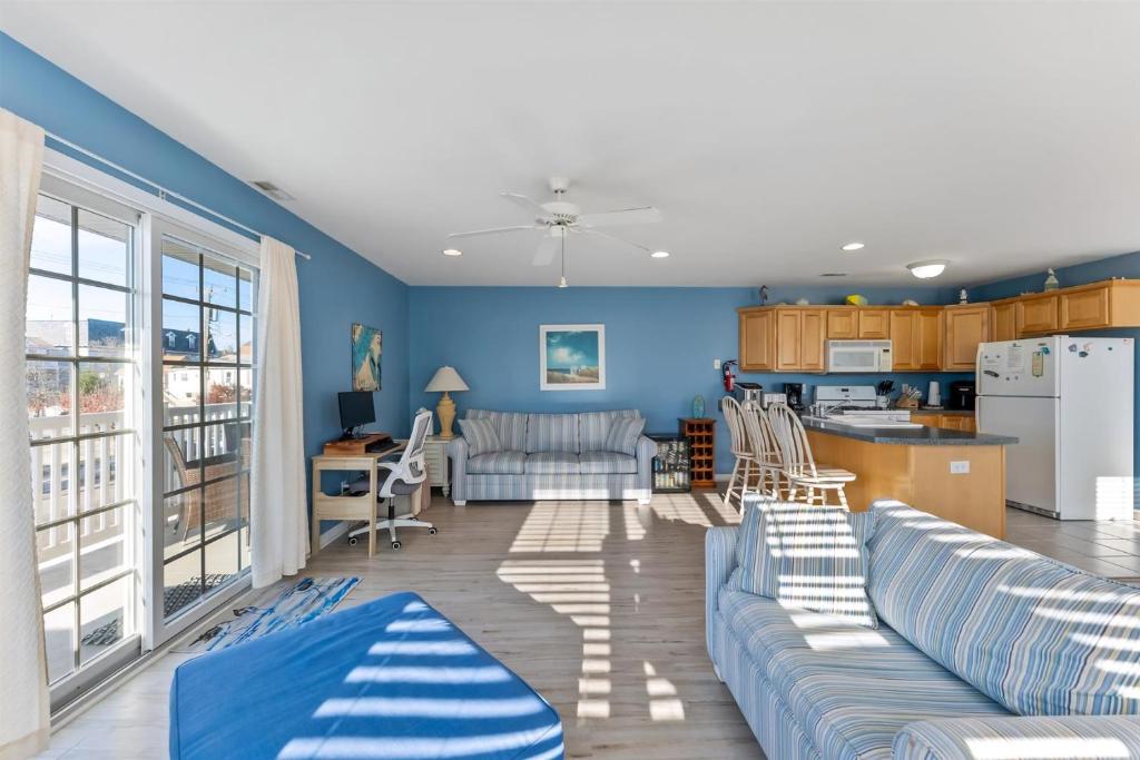 a living room with a couch and a kitchen at 235 E Spicer Ave, Unit A in Wildwood