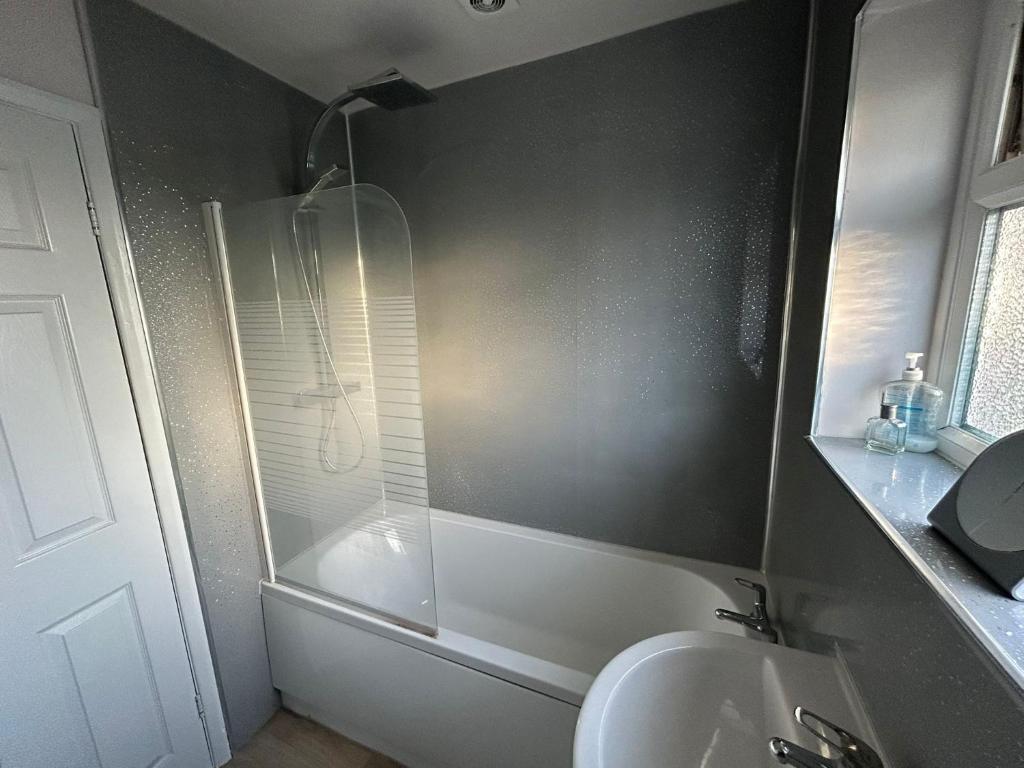 a bathroom with a shower and a sink at City Stays Norwich NR3 in NWI