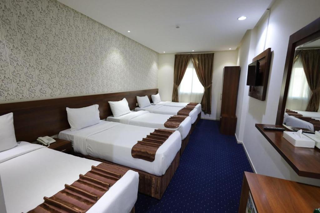 Кровать или кровати в номере Maysan Al Safa Hotel