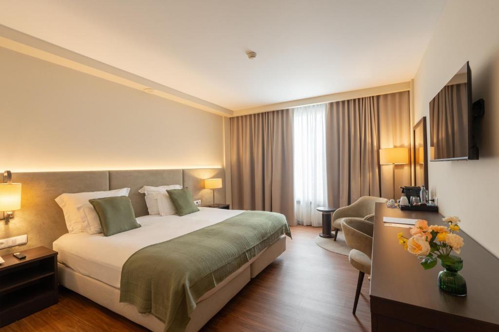 Postel nebo postele na pokoji v ubytování Hotel Premium Porto Maia