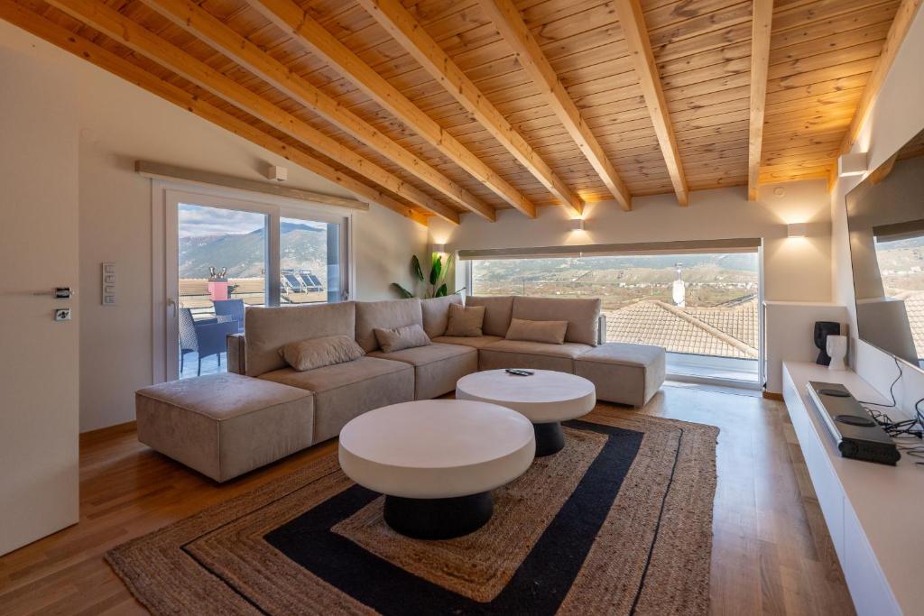 a living room with a couch and a table at Suite Room 33 Ioannina - Near airport in Ioannina