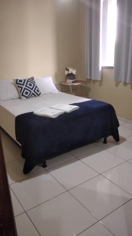 En eller flere senge i et værelse på Hotel João de Barro