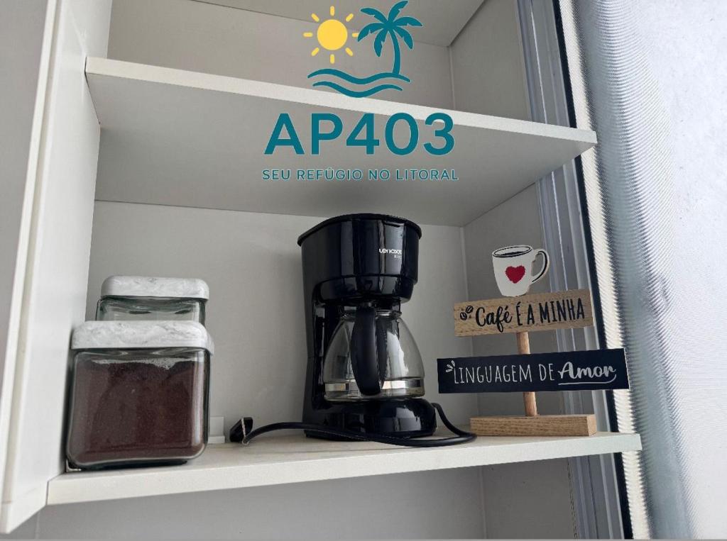 Et logo, certifikat, skilt eller en pris der bliver vist frem på Apto 403 - 500 metros da Praia