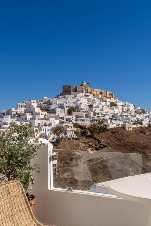 a view of a city from the balcony of a house at Atlantic Island Suites in Astypalaia