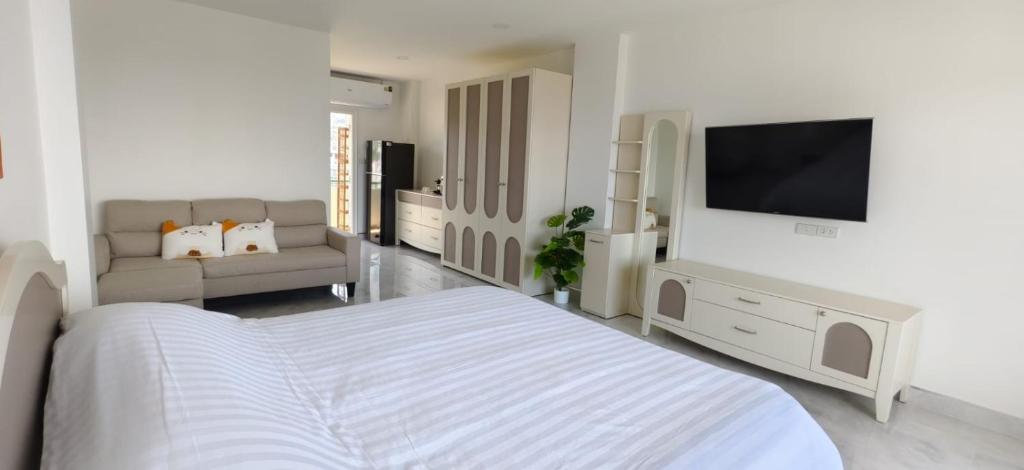 Postel nebo postele na pokoji v ubytování patong sea view-high floor