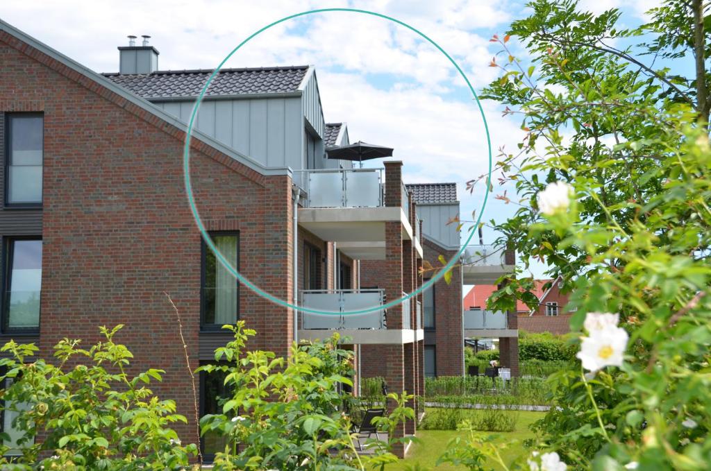 a brick house with a spiralling building at Kirschgarten 17 in Kellenhusen