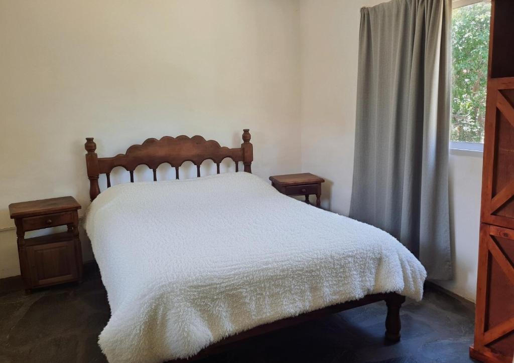 Ένα ή περισσότερα κρεβάτια σε δωμάτιο στο La Armonía Departamentos