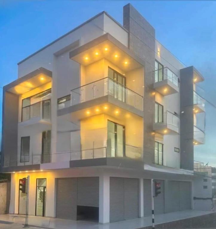 a large white building with lights on it at Apartaestudio amoblado 303 Edificio Buenos Aires Sincelejo in Sincelejo
