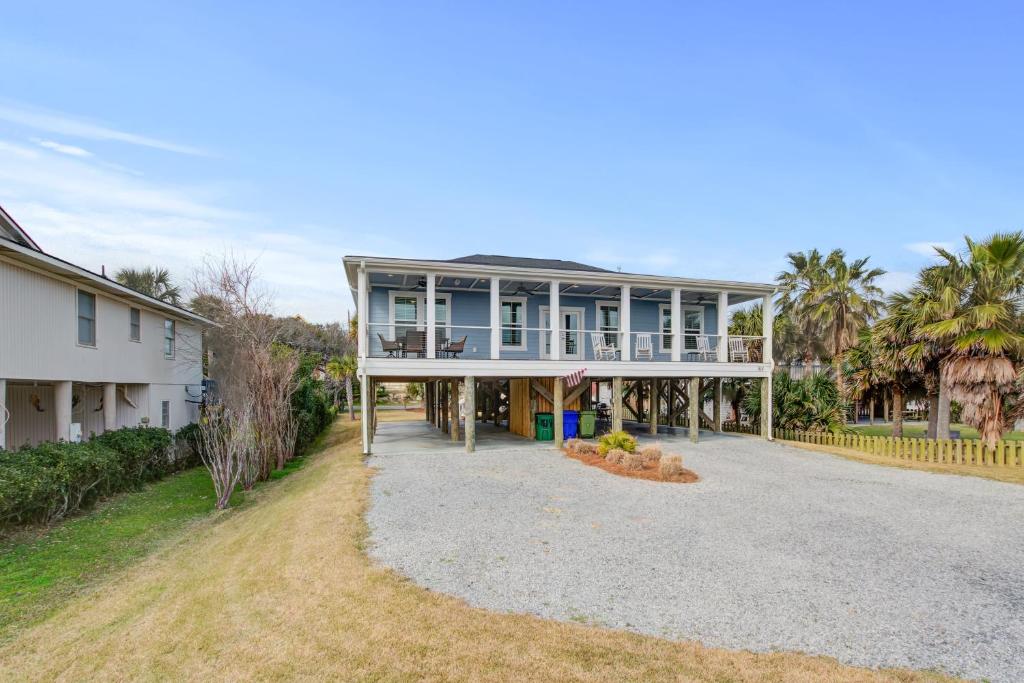 a large house with a large driveway at LaiDDback in Folly Beach