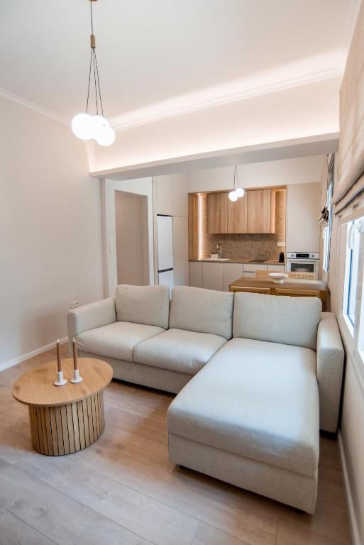 a living room with a couch and a table at 14 luxury apartment in Preveza