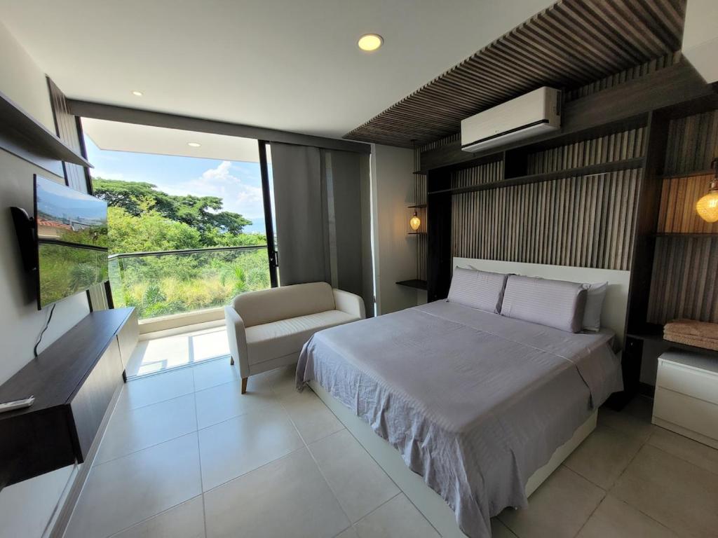 En eller flere senge i et værelse på Cali 2-02 Pance Apto sector exclusivo