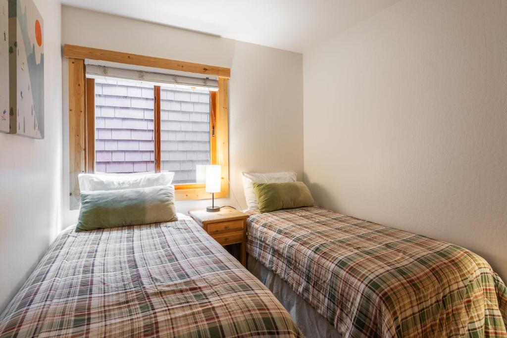 En eller flere senge i et værelse på Northstar - Ski Trail Condo