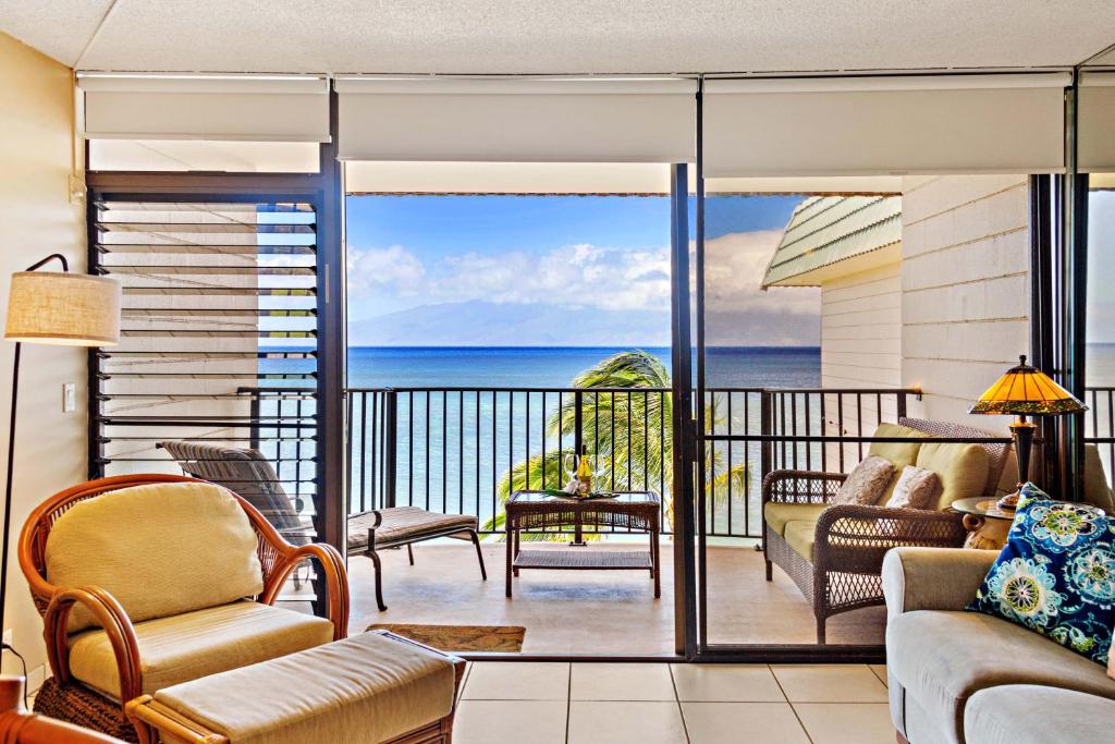 a living room with a view of the ocean at Kahana Reef 408 in Kahana