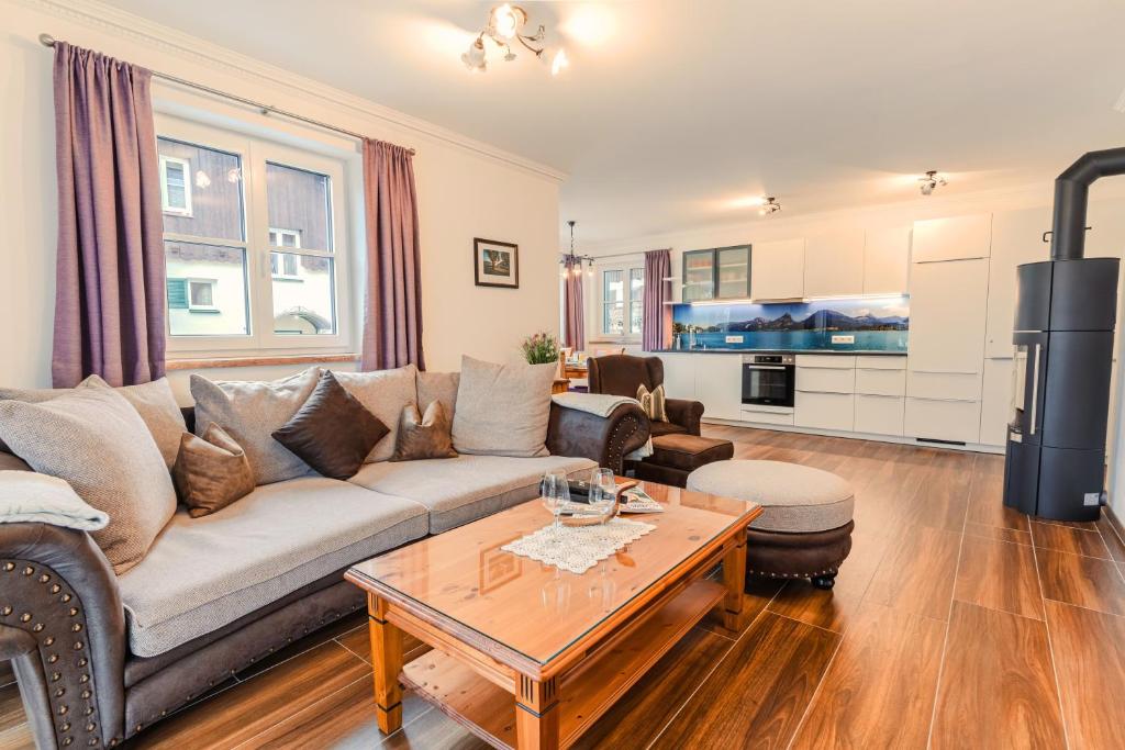 a living room with a couch and a table at Villa Eisl-Raudaschl in St. Wolfgang