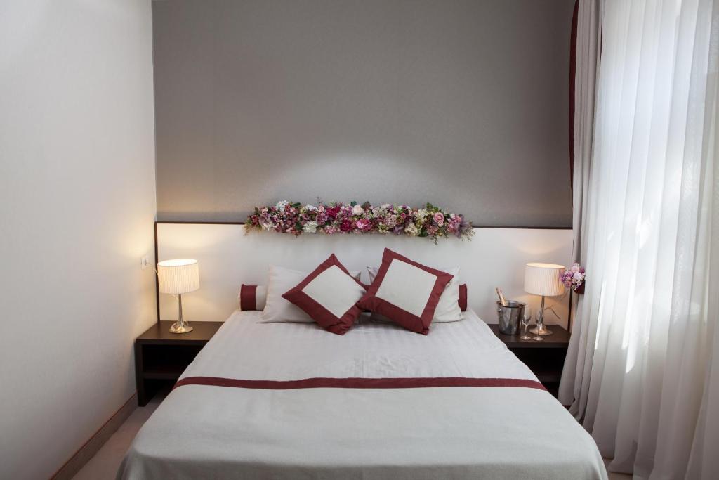Postel nebo postele na pokoji v ubytování Boutique Hotel Palais Royal