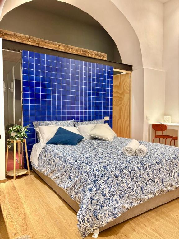 Кровать или кровати в номере Petit Marchè