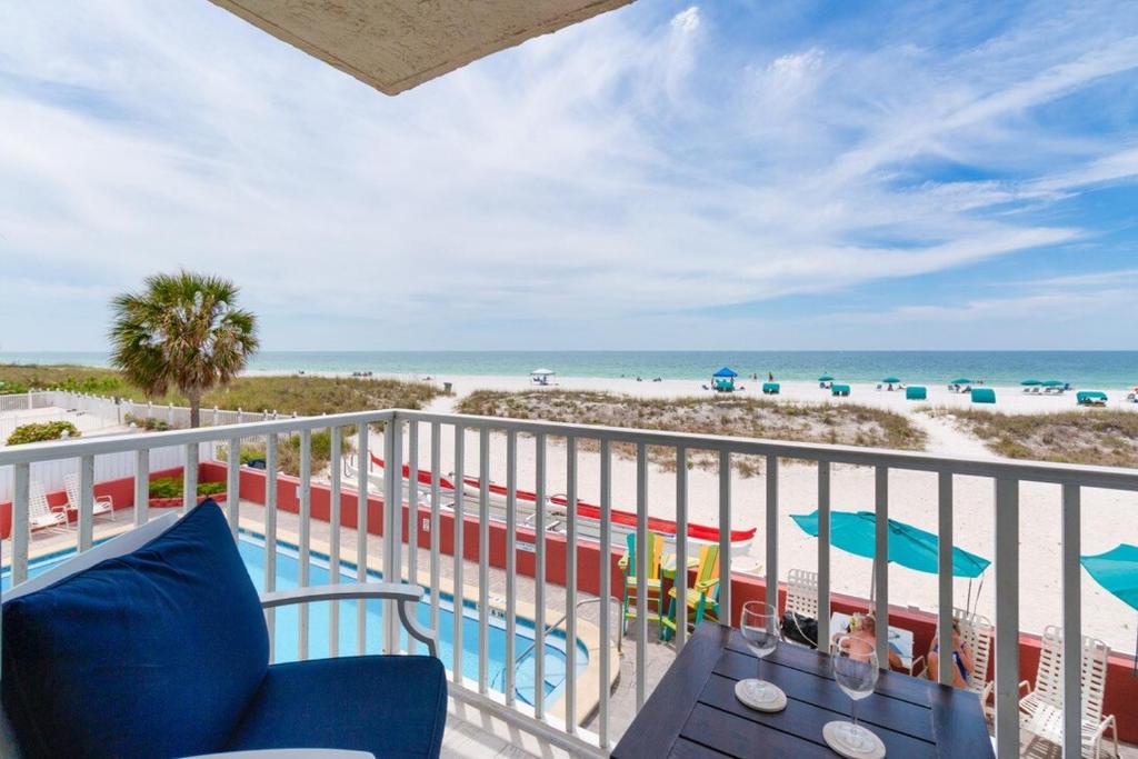 a balcony with a view of the beach and the ocean at EPIC Gulf & Beach Views with Balcony, Beach Supplies, & Pool in St. Pete Beach