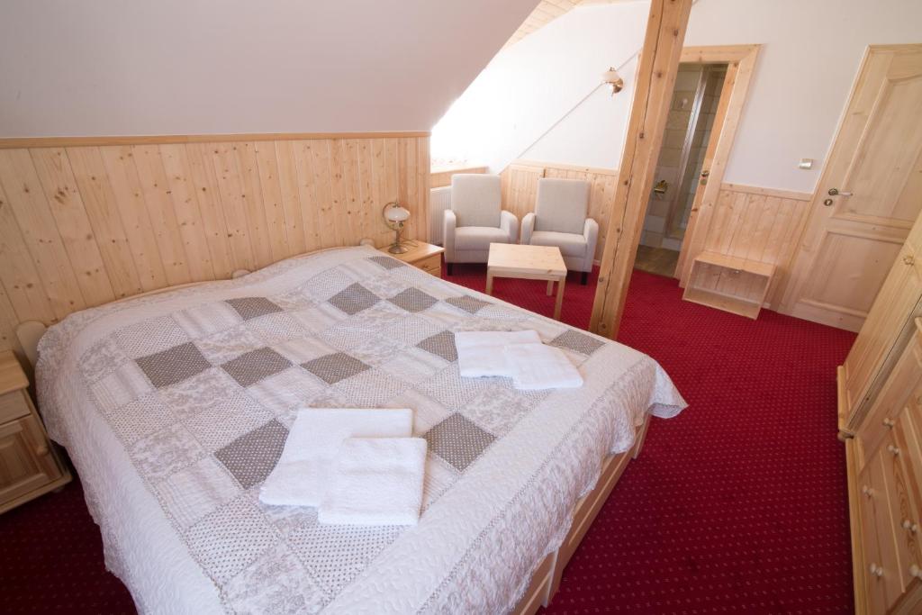 Postel nebo postele na pokoji v ubytování Penzion U Pacošů