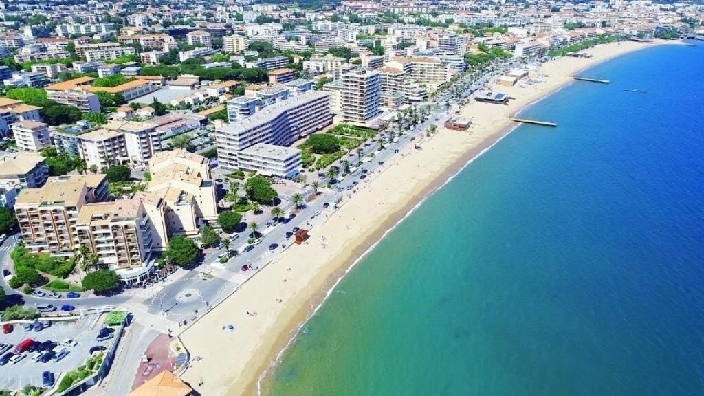 an aerial view of a beach with buildings and the ocean at T2 Port Frejus Grand Garage Prive in Fréjus