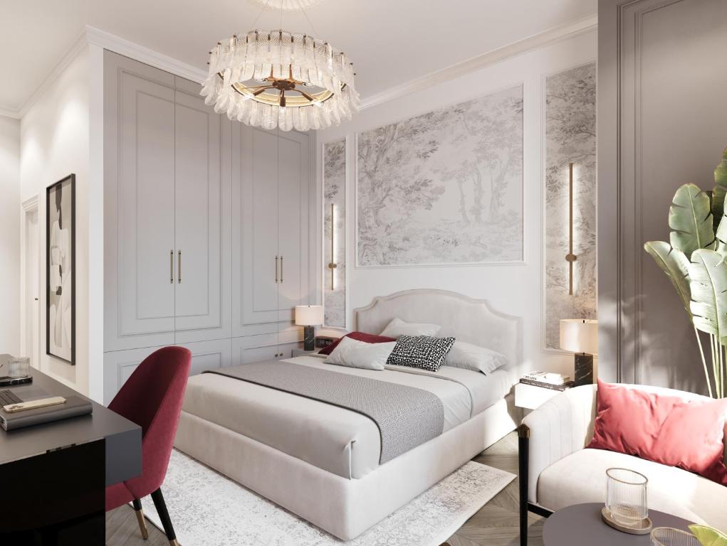 En eller flere senge i et værelse på White Gallo Residences