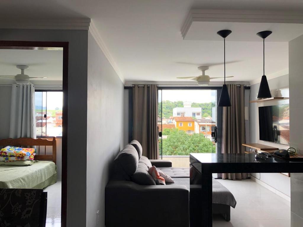 Et opholdsområde på Apartamento Piúma