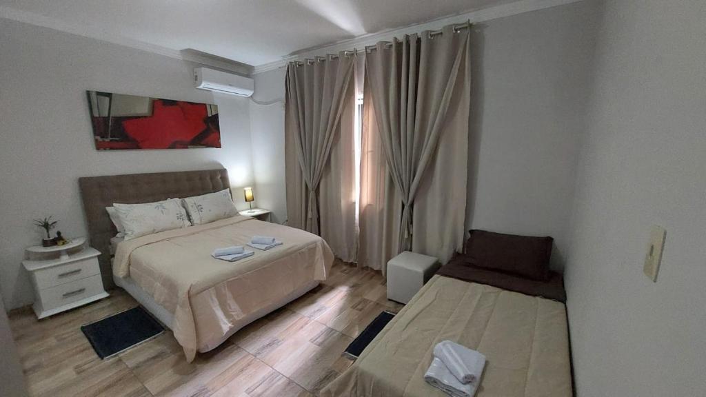 Ένα ή περισσότερα κρεβάτια σε δωμάτιο στο Casa Alegre Beach House