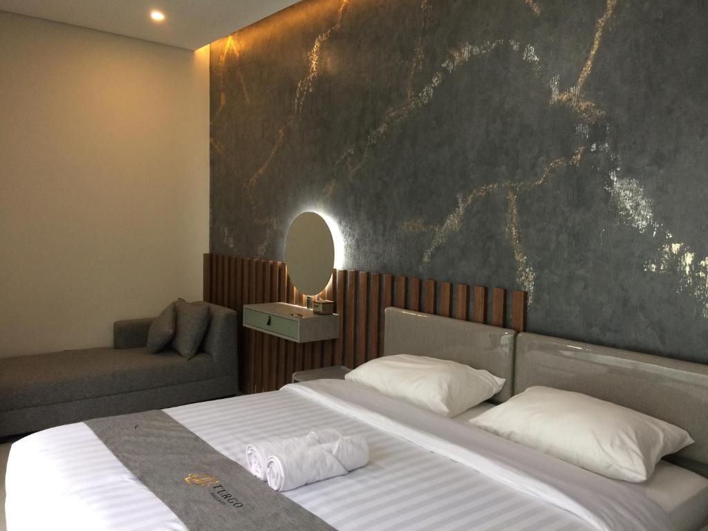 Postel nebo postele na pokoji v ubytování di Turgo Village