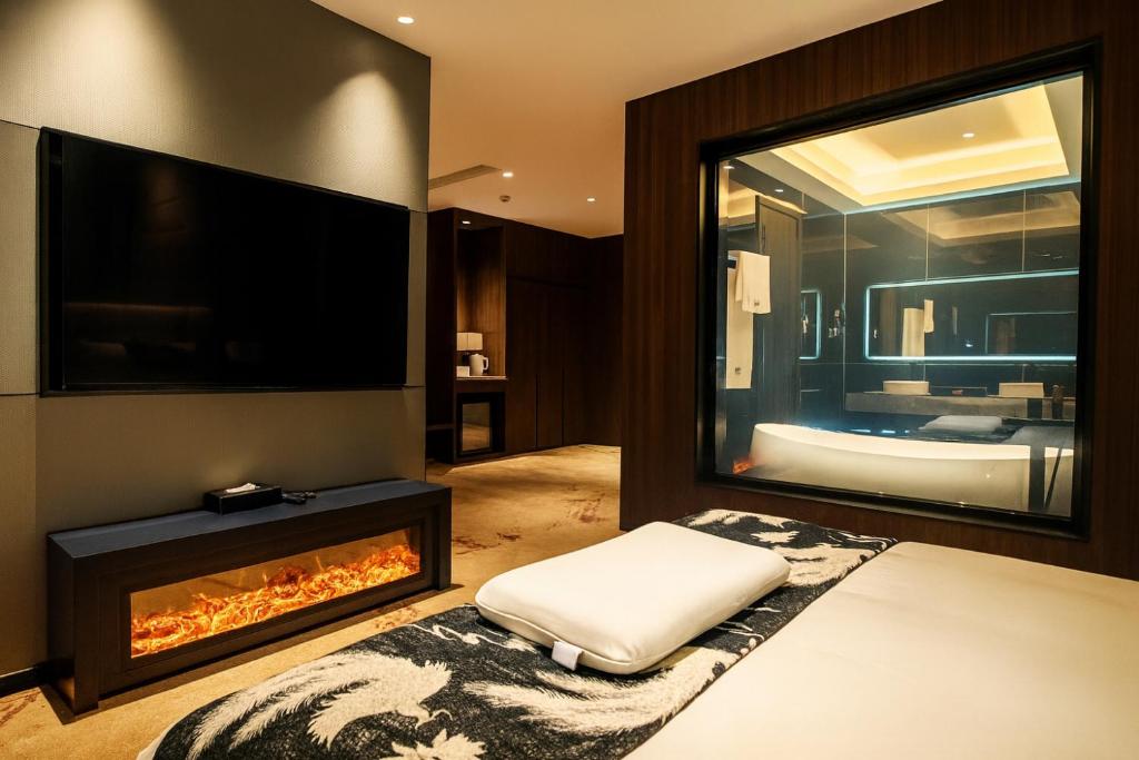 Una cama o camas en una habitación de ESP Hotel