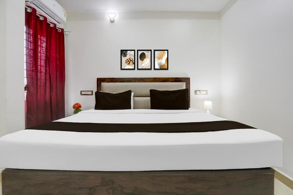 Ένα ή περισσότερα κρεβάτια σε δωμάτιο στο Hotel O Aqua Comforts