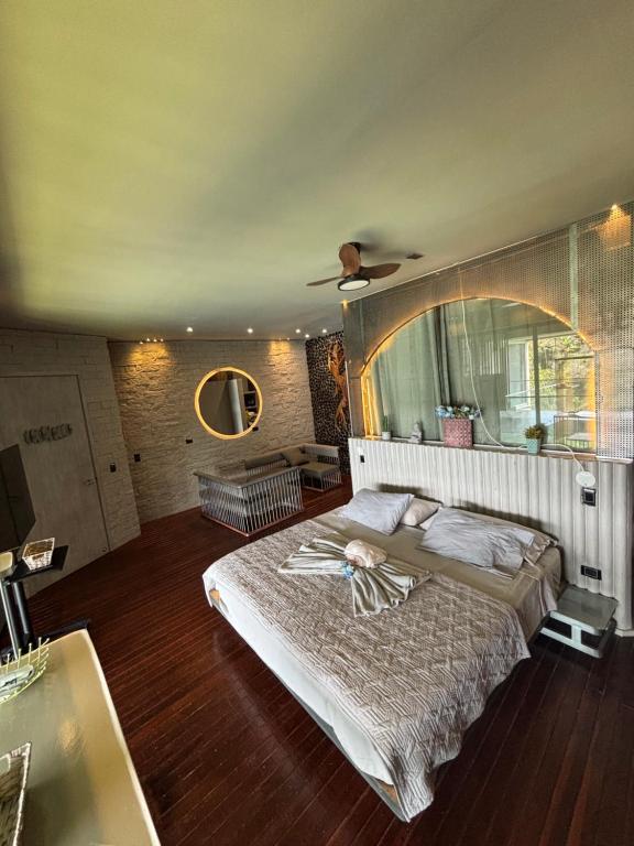 Postel nebo postele na pokoji v ubytování Habitación en Guatape Deluxe Standard Suite