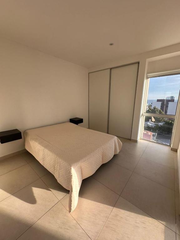 Postel nebo postele na pokoji v ubytování Chacabuco Apart