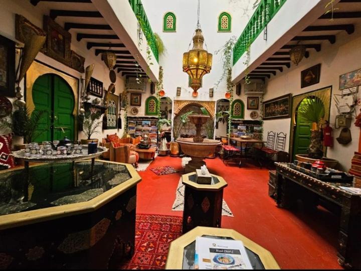 a room with a large room with a large room with a room at riad cherif in Marrakech