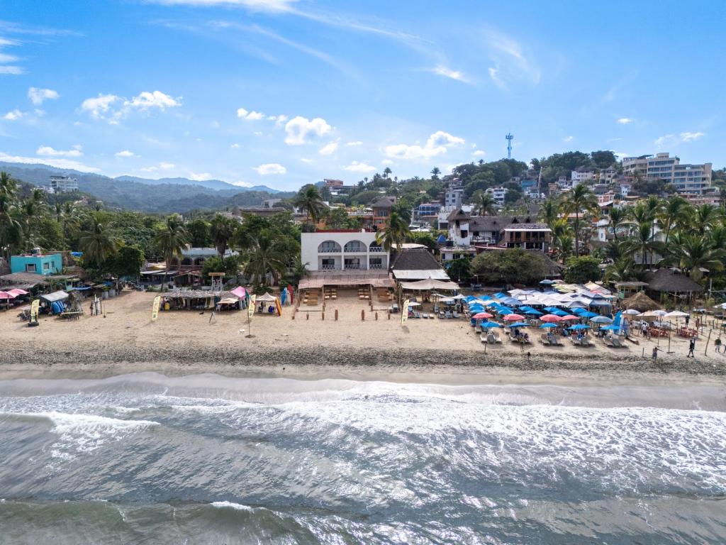an aerial view of a beach with umbrellas at Seres Sayulita Beach Hotel in Sayulita