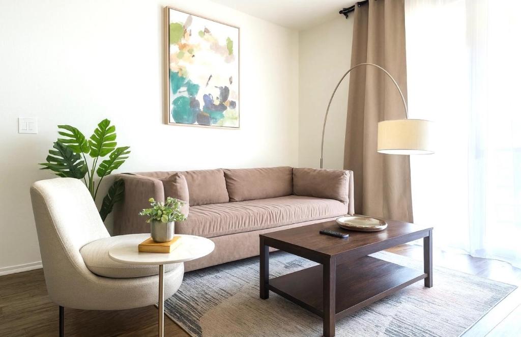 a living room with a couch and a coffee table at Marina Retreat, Near Beaches&SoFI in Los Angeles