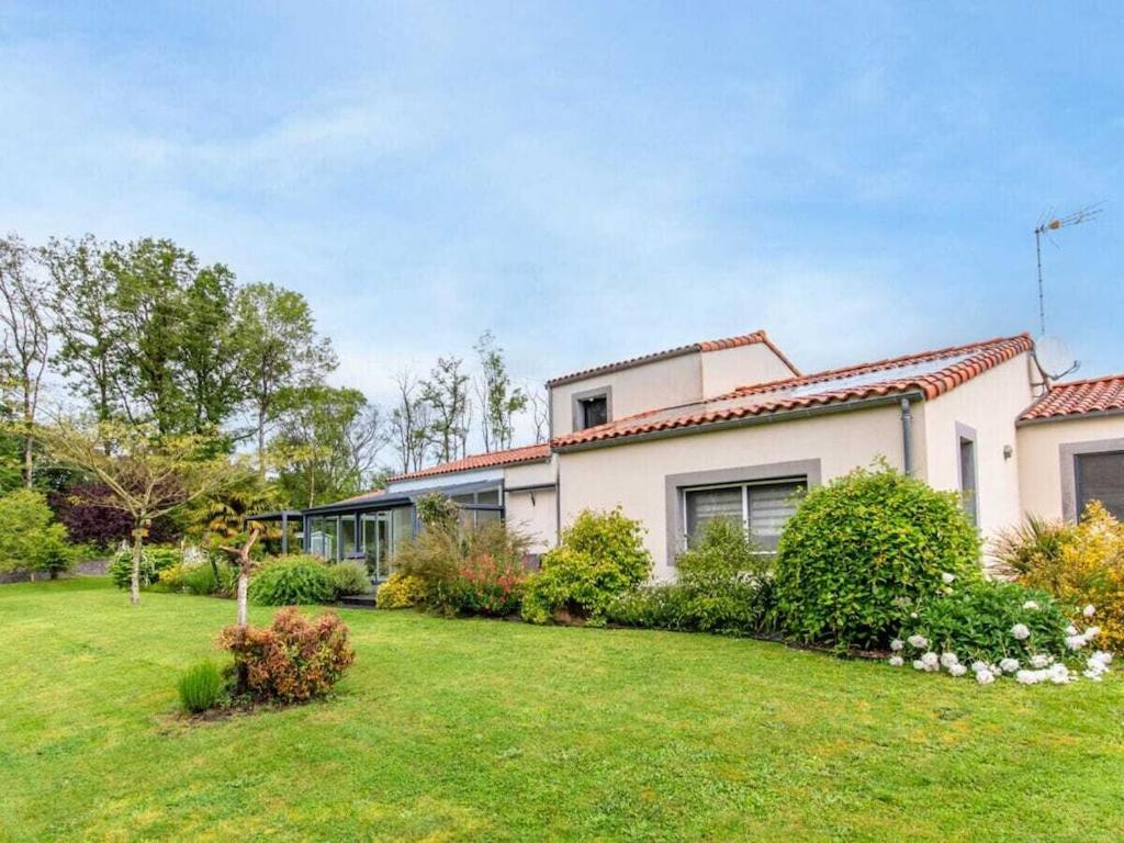 a house with a green yard in front of it at DUXCAAR Mervent in Mervent