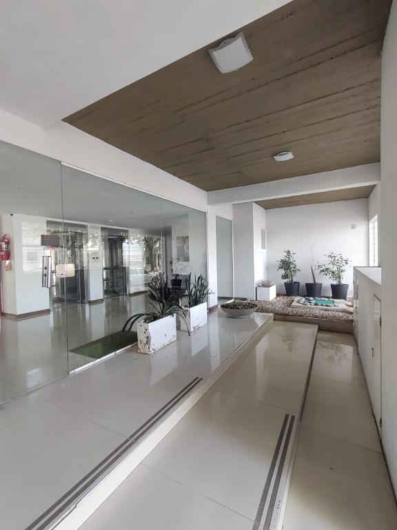 a large living room with a glass floor at Torre 1 Estadio Unico in La Plata