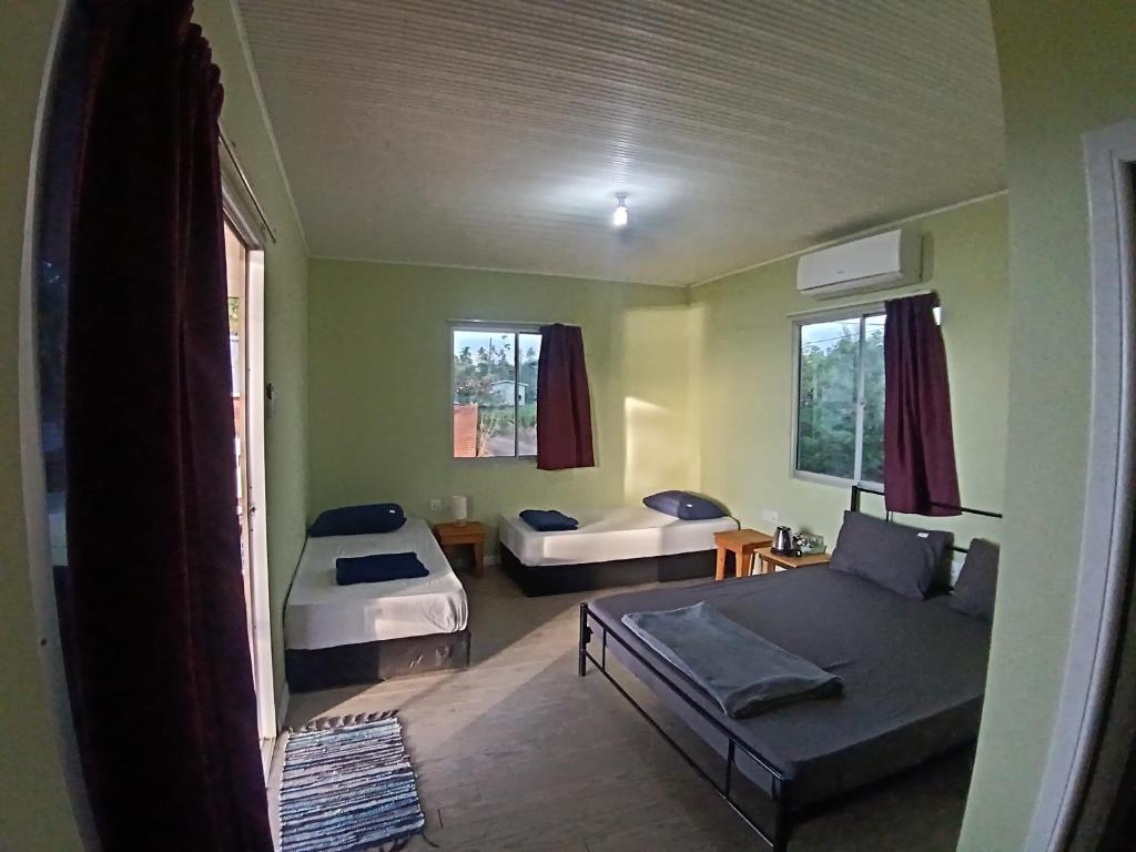 Ένα ή περισσότερα κρεβάτια σε δωμάτιο στο KBH Guest House