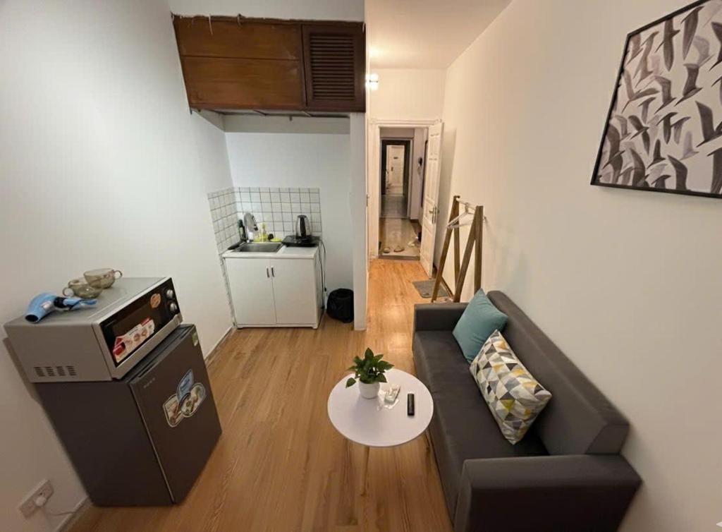 a living room with a couch and a table at Ha Noi Old Quarter Apartment L'Thao in Hanoi