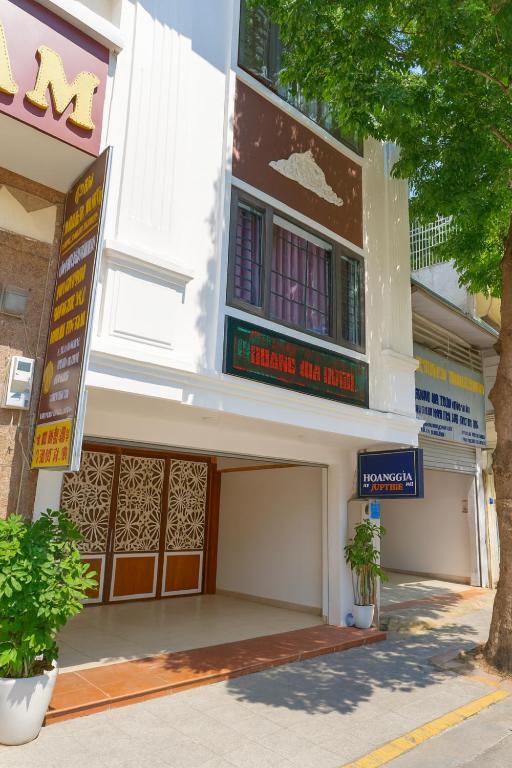 a building with a sign that reads nursing and night at Hoàng Gia Long Biên Hotel in Hanoi