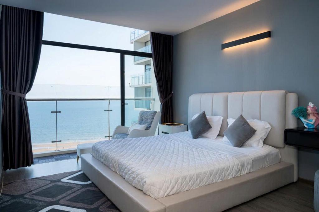 Postel nebo postele na pokoji v ubytování Condotel CSJ Tower Vũng Tàu - Căn hộ du lịch cạnh biển
