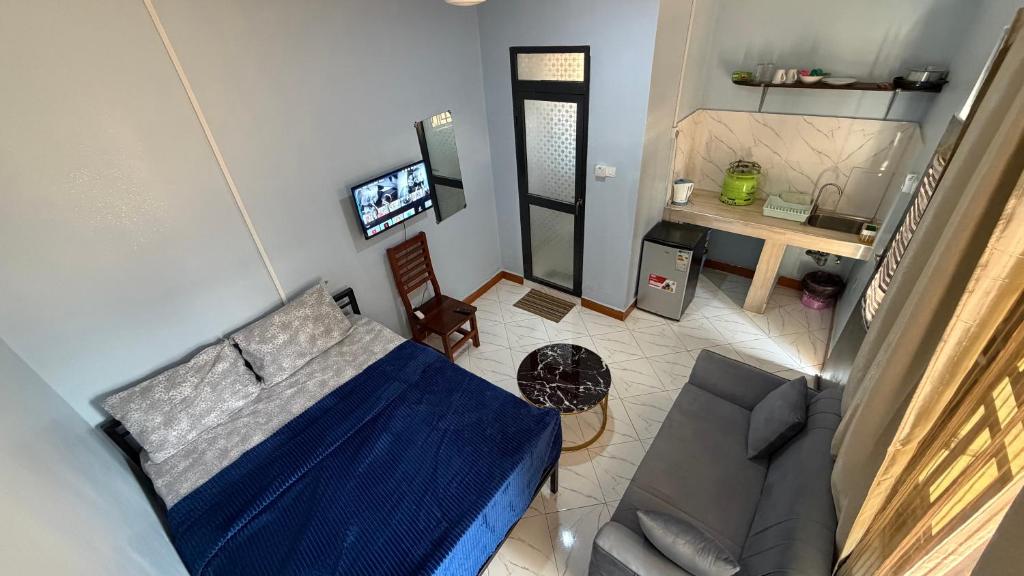 an overhead view of a living room with a couch at COMFORT HAVEN Studio in Ilemera
