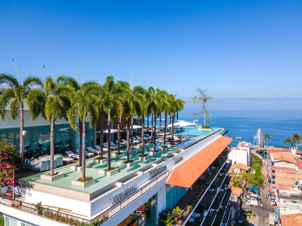 an overhead view of a building with palm trees on it at Pier 57 Romantic Zone Luxury Condo 209 in Puerto Vallarta