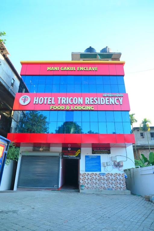 a hotel fusion residency building with a sign on it at Hotel Tricon Residency in Guwahati