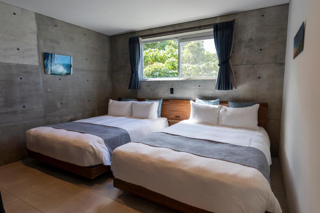 Postel nebo postele na pokoji v ubytování Emerald Ocean Villa