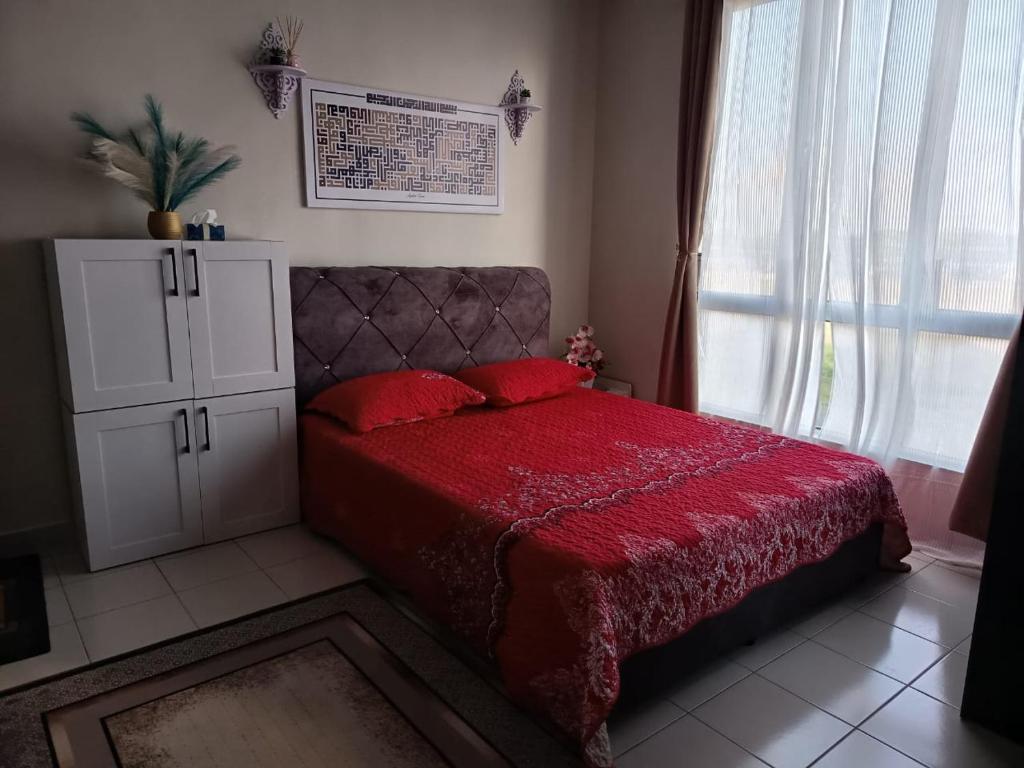 Postel nebo postele na pokoji v ubytování Homestay Baitul Mahabbah Melaka