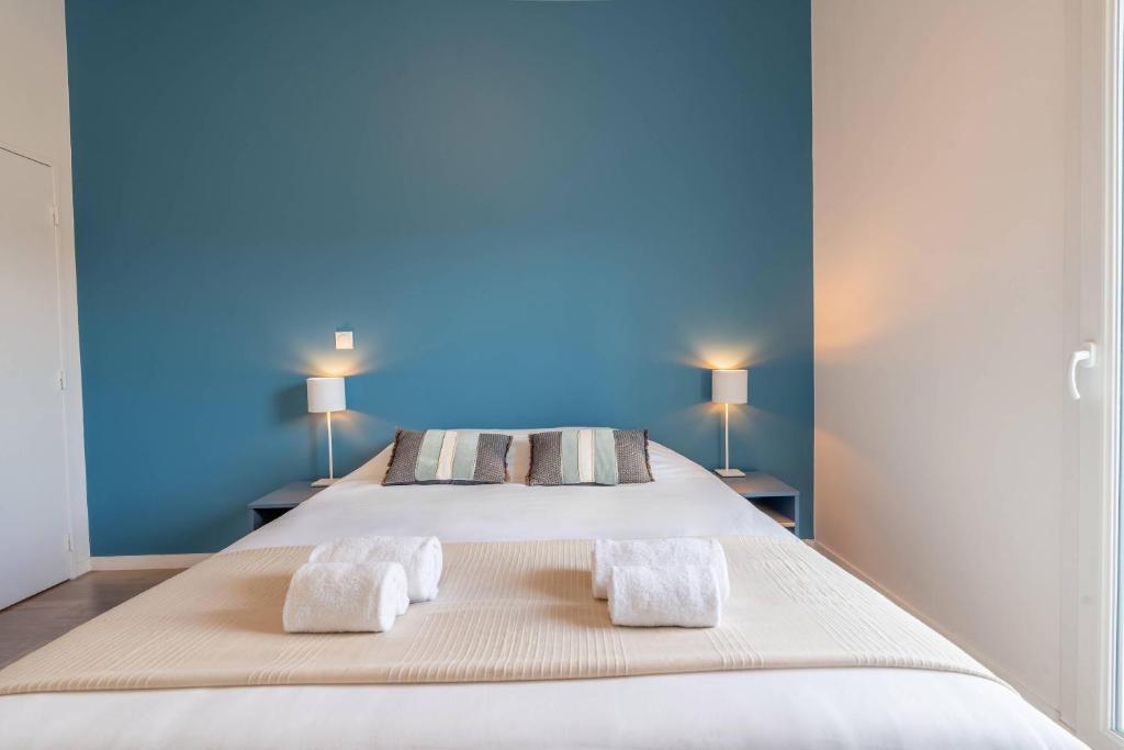 Postel nebo postele na pokoji v ubytování Quality Suites Chambéry