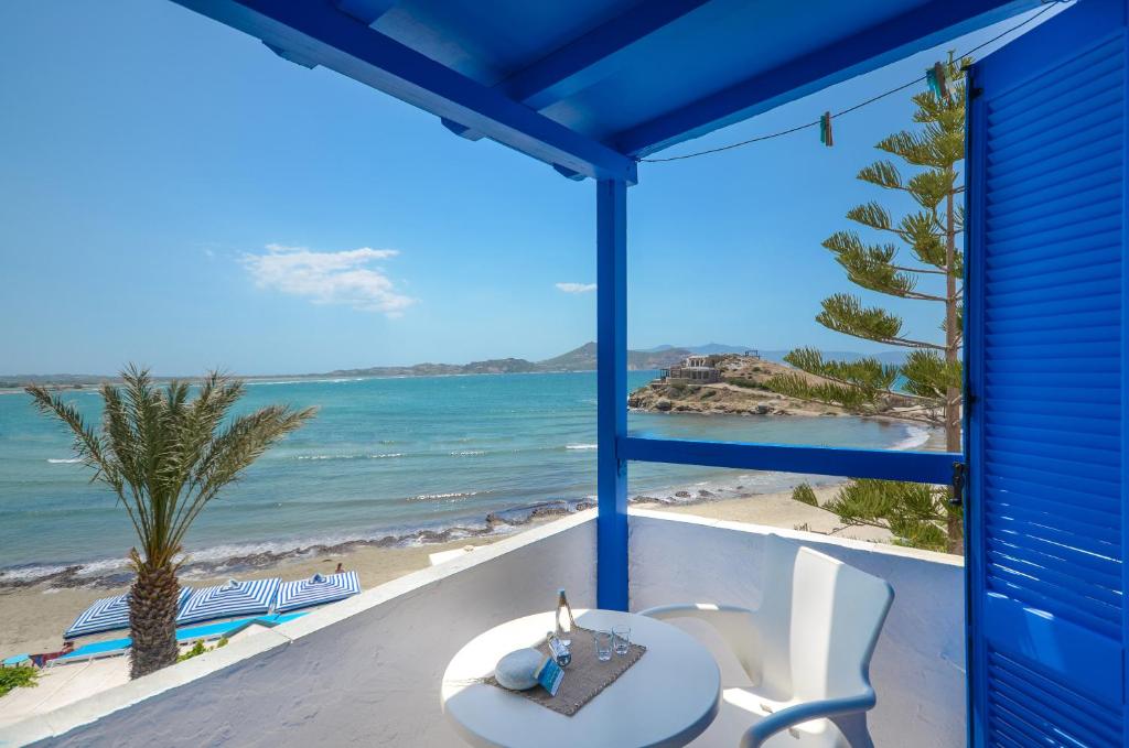 a view of the beach from a beach house balcony at Diogenis Studios in Naxos Chora