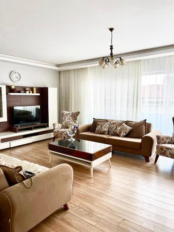 a living room with a couch and a coffee table at Duplex Apartment in Yalova in Yalova